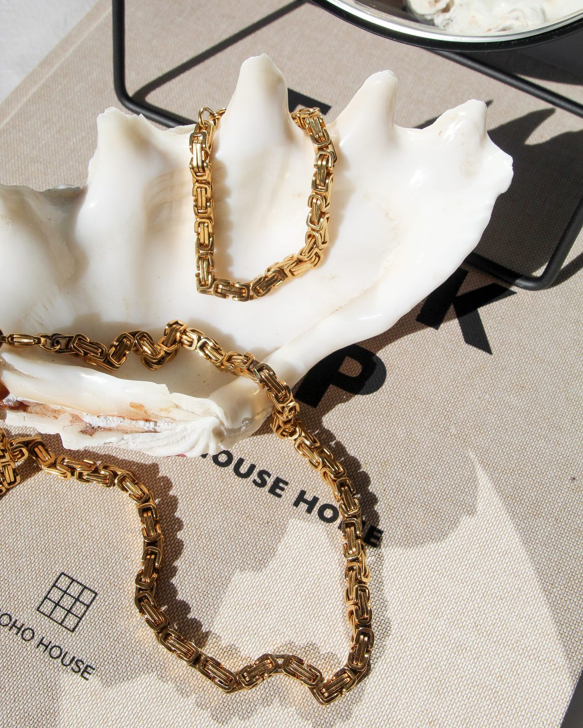 flatlay featuring the bare sea 18K gold plated sterling silver adriana necklace 